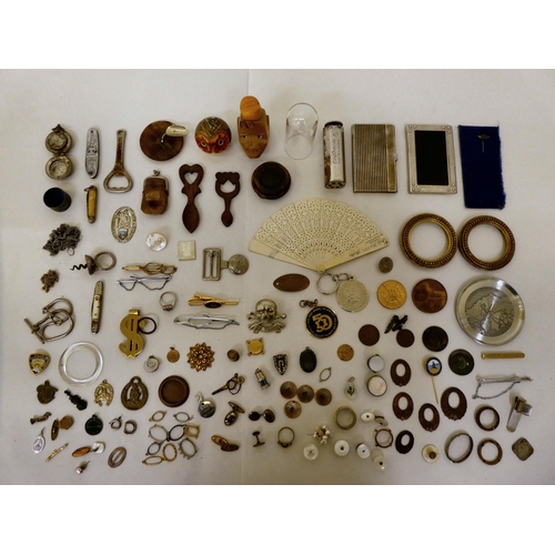 203 - Small 20thC collectables and items of personal ornament: to include money clips; and business card c... 