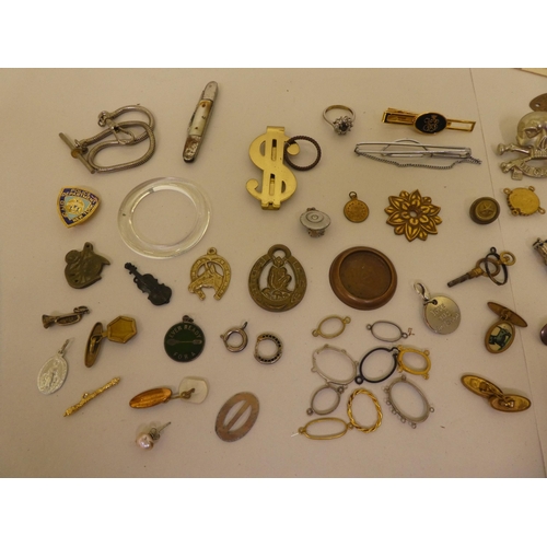 203 - Small 20thC collectables and items of personal ornament: to include money clips; and business card c... 