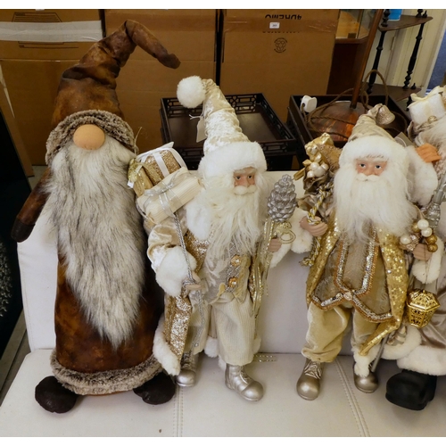 204 - Christmas related collectables: to include a ceramic Santa, dressed in silver  22