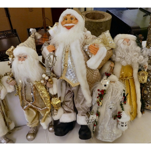 204 - Christmas related collectables: to include a ceramic Santa, dressed in silver  22