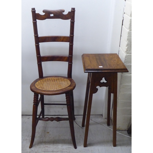 21 - Small furniture: to include a late 19thC stained beech framed correction chair with a cane seat, rai... 