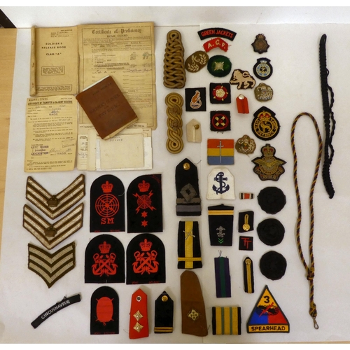 216 - Military collectables: to include fabric badges(Please Note: this lot is subject to the statement ma... 