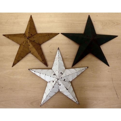 225 - Three overpainted cast metal Amish barn stars  15