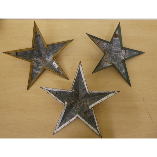 225 - Three overpainted cast metal Amish barn stars  15