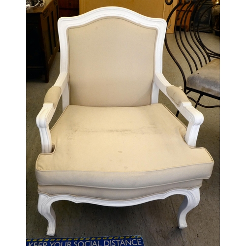 237 - A modern white painted showwood framed open arm chair, upholstered in cream coloured fabric, raised ... 