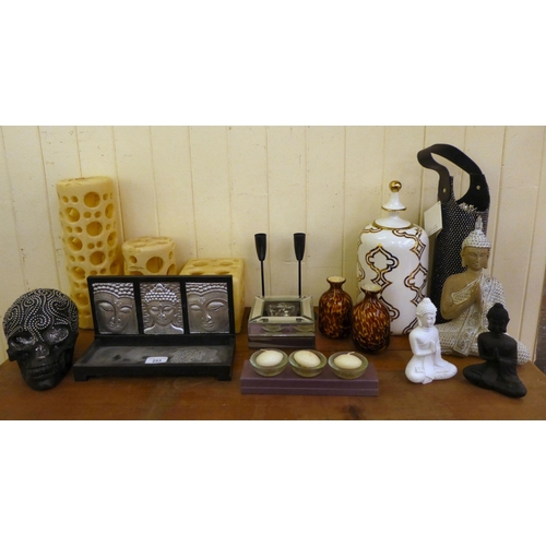 253 - Interior design accessories: to include Thai figures and candles