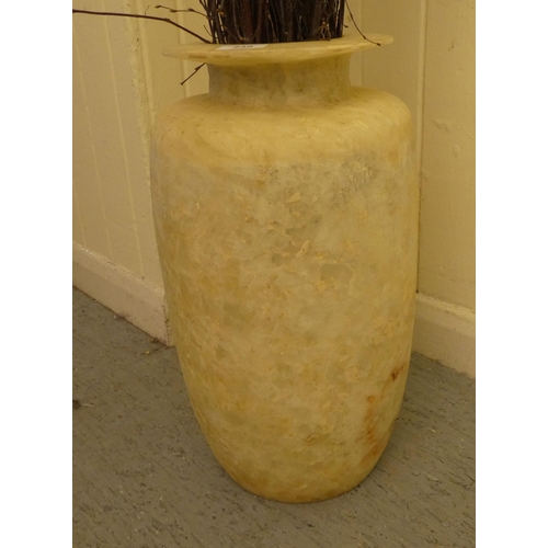 258 - An alabaster vase, containing willow branches  18