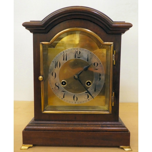 259 - An Edwardian mahogany cased mantel clock; the 8 day movement faced by an Arabic dial  12