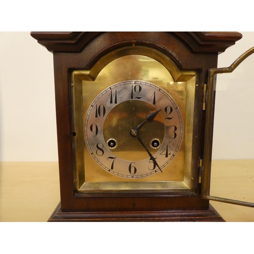 259 - An Edwardian mahogany cased mantel clock; the 8 day movement faced by an Arabic dial  12