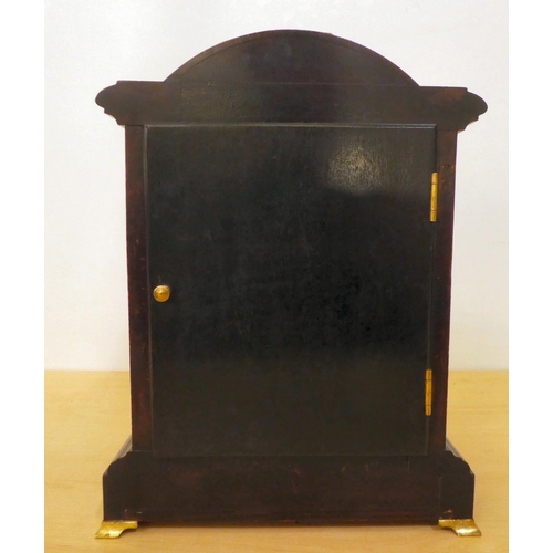 259 - An Edwardian mahogany cased mantel clock; the 8 day movement faced by an Arabic dial  12