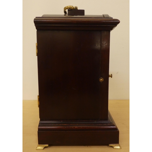 259 - An Edwardian mahogany cased mantel clock; the 8 day movement faced by an Arabic dial  12