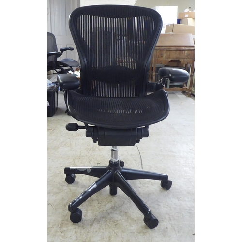 27 - A Herman Miller Aeron design, swivel office chair, raised on casters