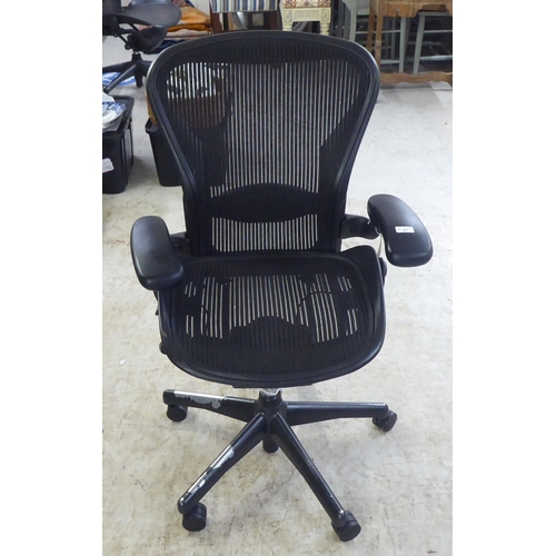 27 - A Herman Miller Aeron design, swivel office chair, raised on casters