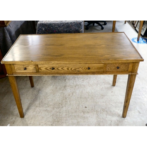 275 - A modern OKA oak desk with three drawers, raised on square, tapered legs  31