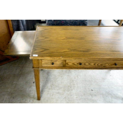 275 - A modern OKA oak desk with three drawers, raised on square, tapered legs  31