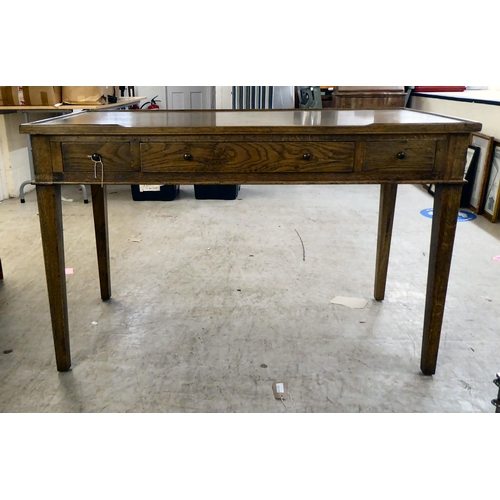 277 - A modern OKA oak desk with three drawers, raised on square, tapered legs  31