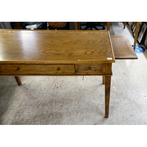 278 - A modern OKA oak desk with three drawers, raised on square, tapered legs  31