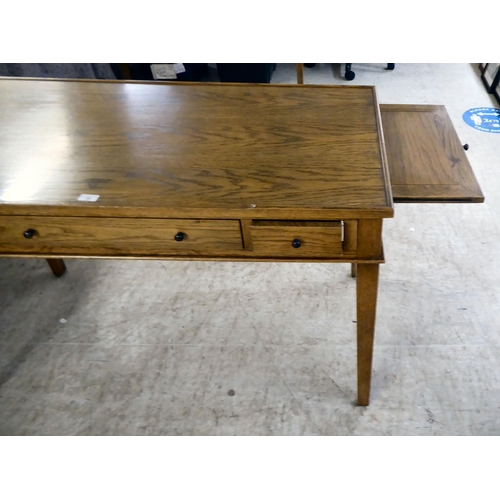 28 - A modern OKA oak desk with three drawers, raised on square, tapered legs  31