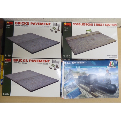 29 - 1/35 scale model kits and terrain: to include by Heller, a US 1/4 ton truck and trailer; and a ruine... 