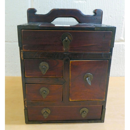 3 - A 20thC Chinese lacquered elm medicine chest with five drawers, on a plinth  12