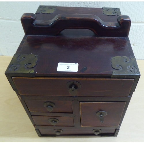 3 - A 20thC Chinese lacquered elm medicine chest with five drawers, on a plinth  12