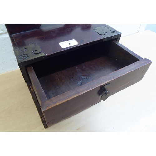 3 - A 20thC Chinese lacquered elm medicine chest with five drawers, on a plinth  12