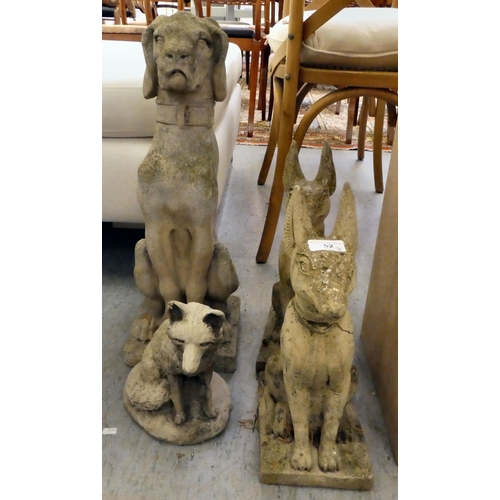 52 - Four composition stone garden ornaments: to include an Egyptian Bastet  16