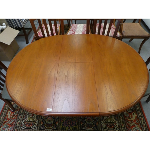 58 - A mid 20thC Stag teak dining table, raised on splayed legs  30