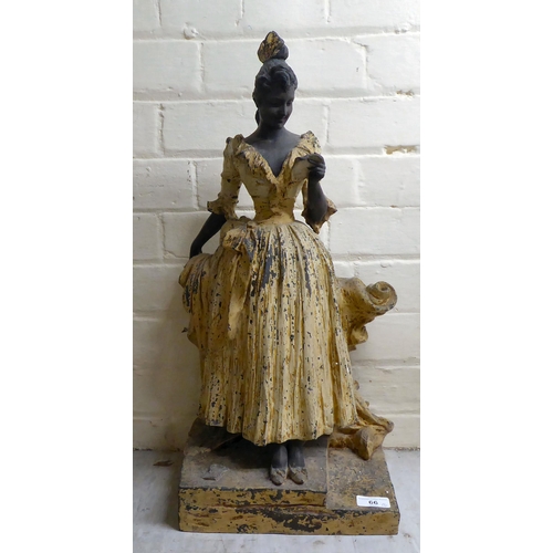 66 - A late Victorian painted spelter figure, a woman reading a letter  23