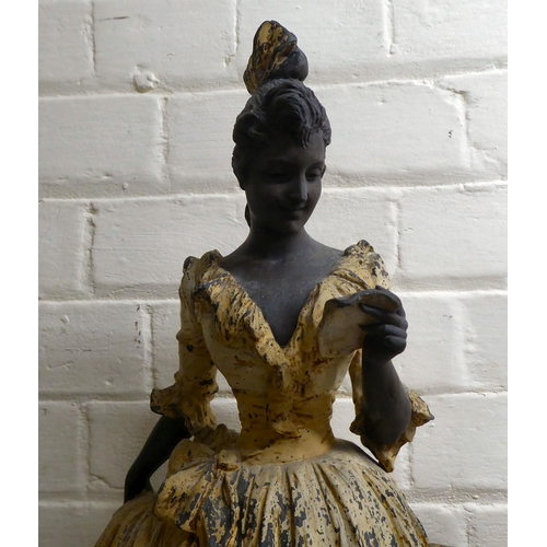 66 - A late Victorian painted spelter figure, a woman reading a letter  23