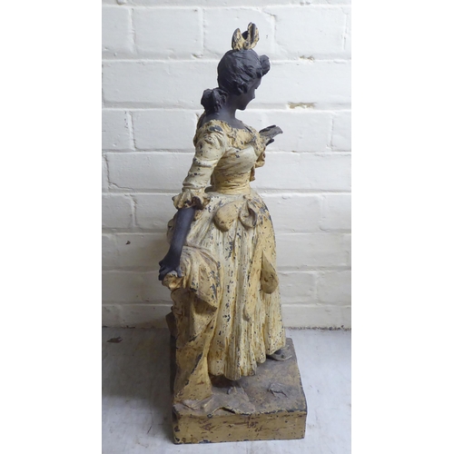 66 - A late Victorian painted spelter figure, a woman reading a letter  23