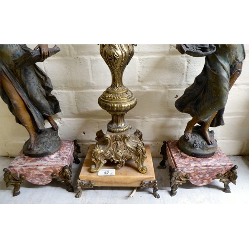 67 - A mixed lot: to include a pair of late Victorian spelter figures, scantily clad women, each on a mar... 