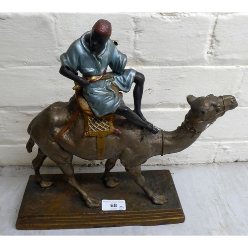 68 - A late Victorian painted spelter model, a man riding a camel  12