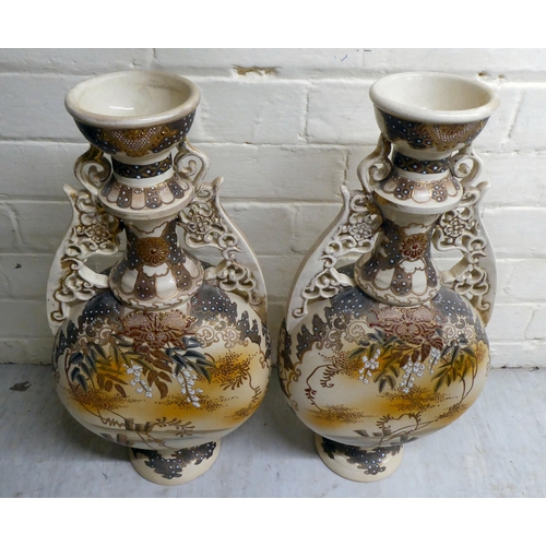 80 - A pair of early 20thC Japanese earthenware moon flask vases, decorated with warriors  19