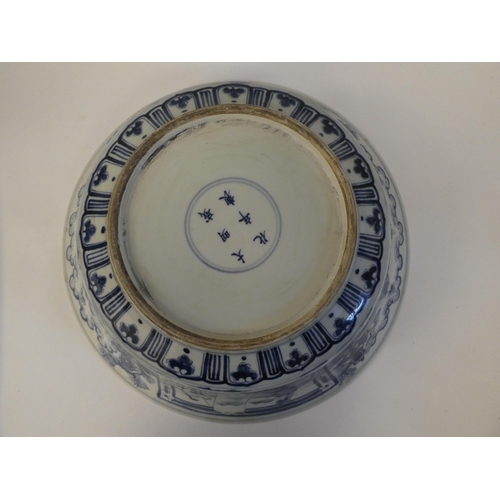 85 - A 20thC Chinese porcelain bowl, decorated with fish and figures  bears a six character mark&nbs... 