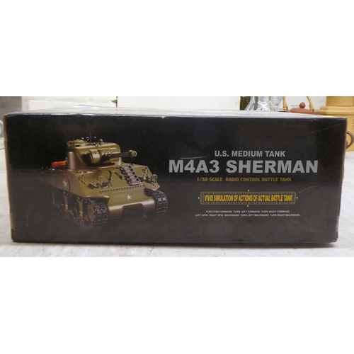 90 - A 1/30 scale radio controlled model of an M4A3 Sherman Tank by Heng Long