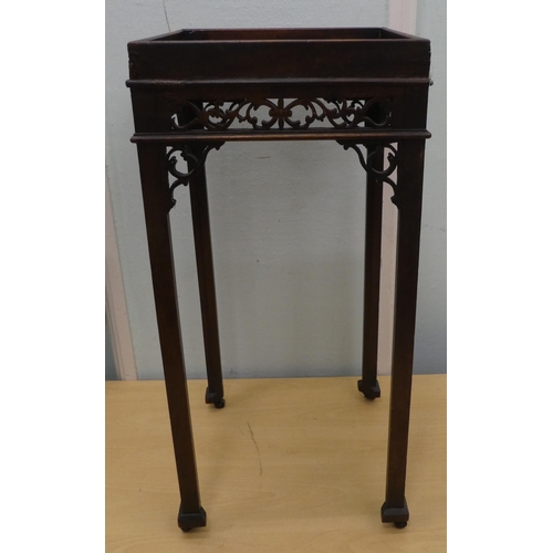 93 - A Georgian Chippendale inspired, mahogany kettle stand with a fretwork gallery, raised on rectangula... 