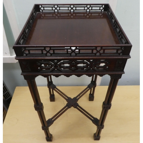 96 - An Edwardian Chippendale inspired mahogany kettle stand with a fretwork gallery, raised on rectangul... 