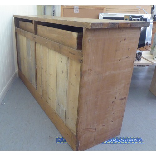 92 - A late Victorian pine dresser base with two drawers and two doors, on a plinth  36