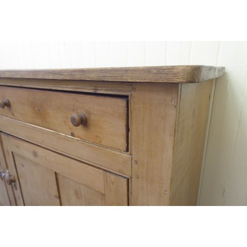 92 - A late Victorian pine dresser base with two drawers and two doors, on a plinth  36