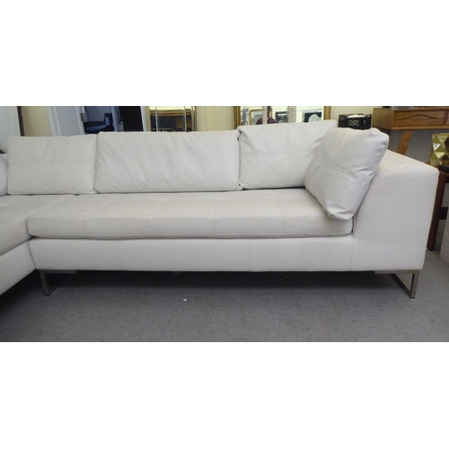 270 - A Dwell stitched white hide upholstered L-shaped, two piece settee, on a steel underframe  113