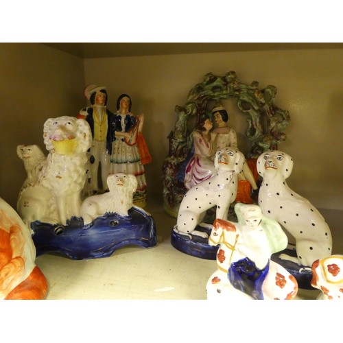 116 - Victorian Staffordshire pottery collectables: to include a man and woman, seated beneath an arbour  ... 