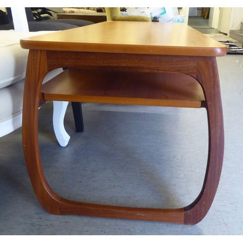 57 - A mid century Parker Knoll teak coffee table with a drawer and two open sections, raised on curved l... 