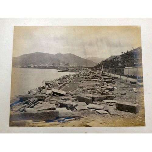 161 - An early/mid 20thC Chinese album, containing monochrome photographs: to include views of Canton; loc... 