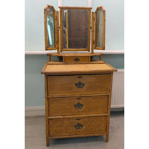 235 - A post World War II Oriental style bamboo and rattan finished dressing table, surmounted by a tripty... 