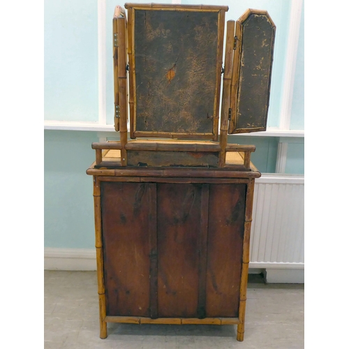 235 - A post World War II Oriental style bamboo and rattan finished dressing table, surmounted by a tripty... 