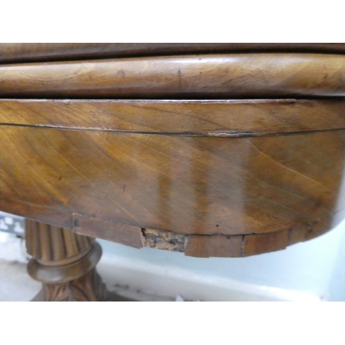 236 - An early/mid 19thC walnut and mahogany D-end tea table, the rotating, foldover top raised on a carve... 