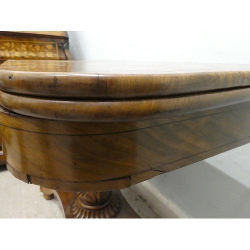 236 - An early/mid 19thC walnut and mahogany D-end tea table, the rotating, foldover top raised on a carve... 