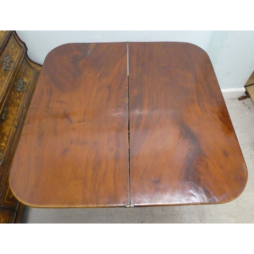 236 - An early/mid 19thC walnut and mahogany D-end tea table, the rotating, foldover top raised on a carve... 