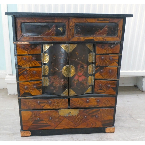 237 - A 20thC Japanese black painted and fruitwood marquetry inlaid table top cabinet with an arrangement ... 